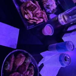 The rib eye dinner with fries and a salad with the whiskey glazed wings