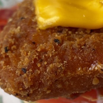 McDonald's - a fried chicken sandwich with mustard on top - Fast Food Near Me - Regina, Saskatchewan McDonald's - a fried chicken sandwich with mustard on top - Fast Food Near Me - Regina, Saskatchewan