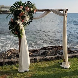 Wedding arch rental and flower arrangement