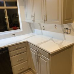 Sky Granite - Quartz countertop with full wall backsplash