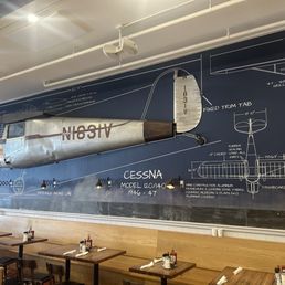 An actual airplane hanging on the wall! Cool! An actual airplane hanging on the wall! Cool!