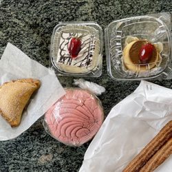 La Luz Bakery - Top row (left to right): tres leches cake, flan Bottom row (left to right): rice pudding empanada, cinnamon concha bread, churros