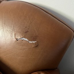 Torn backrest on our 22-year old Couch. Before restoration. Torn backrest on our 22-year old Couch. Before restoration.