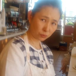 a woman in a kitchen a woman in a kitchen