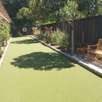 Affordable Landscape & Design - Backyard Bocce ball court (with putting green grass) - Landscaping Near Me