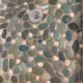 Knowles House - yes that is the color and the dark between the rock is mold or something under in the grout. I should have inspected the bathroom - Vacation Rentals Near Me - Key West, Florida