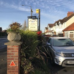 Moonraker House - Hotel sign by the street