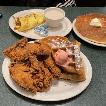 Metro Diner - Chicken & waffles and a veggie omelet with grits and pancakes. - Diners Near Me - Melbourne, Florida Metro Diner - Chicken & waffles and a veggie omelet with grits and pancakes. - Diners Near Me - Melbourne, Florida