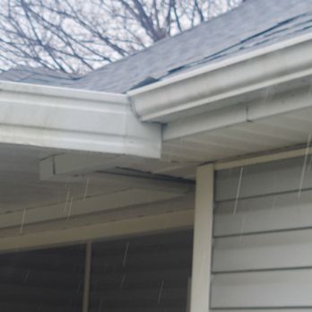Grasshopper Roofing - flashing overhanging gutter. when I mentioned this, I was informed all roofs look like this - Roofing Near Me
