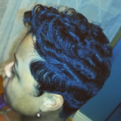 The Glam Lounge - Relaxed hair gently waved at the base then curled for desired look