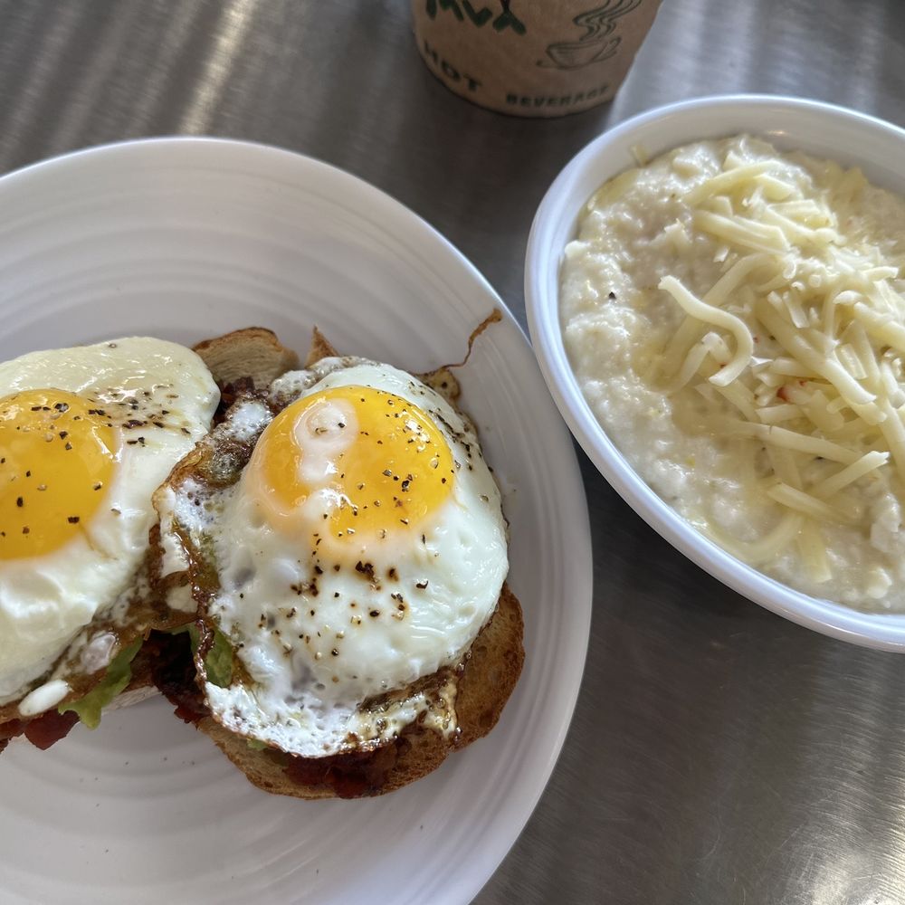 Marmalade Cafe and Bakery - Avocado toast with pepper jack grits. - Coffee & Tea Near Me - Morehead City, North Carolina Marmalade Cafe and Bakery - Avocado toast with pepper jack grits. - Coffee & Tea Near Me - Morehead City, North Carolina