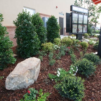 Shuff Landscape Service - a large rock in front of a building - Landscaping Near Me - Maben, Mississippi