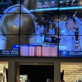 Hooters - a basketball game being played on a big screen - Chicken Wings Near Me - Buford, Georgia