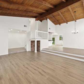 Three Point Construction - an empty living room with a staircase leading to the second floor - General Contractors Near Me - Murrieta, California