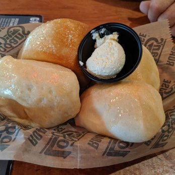 Logan's Roadhouse - Not brown rolls (one in back was) - American Near Me - Holland, Michigan