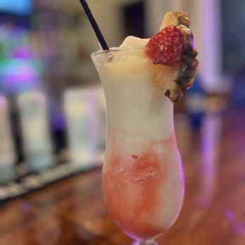 Lanterns Restaurant and Tavern - Strawberry Pina Colada I believe. This was my friends drink. - Bars Near Me - Waianae, Hawaii Lanterns Restaurant and Tavern - Strawberry Pina Colada I believe. This was my friends drink. - Bars Near Me - Waianae, Hawaii