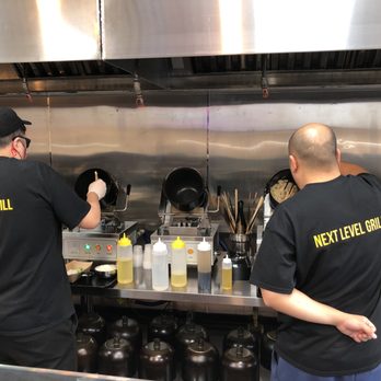 Whealthy - Chefs doing their things at the rotating hot pots. - Asian Fusion Near Me - Sandy Springs, Georgia
