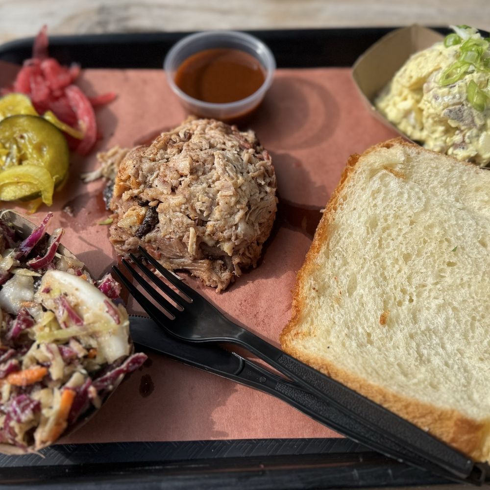 Southern Junction - Pulled pork, slaw, potato salad, Hawaiian bread, pickles and pickled onions, mild BBQ sauce. - Indian Near Me - Buffalo, New York Southern Junction - Pulled pork, slaw, potato salad, Hawaiian bread, pickles and pickled onions, mild BBQ sauce. - Indian Near Me - Buffalo, New York