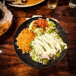 Enchiladas Amozoca: Three grilled chicken and spinach enchiladas topped with our roasted poblano sauce, garnished with queso fresco and sour Enchiladas Amozoca: Three grilled chicken and spinach enchiladas topped with our roasted poblano sauce, garnished with queso fresco and sour