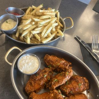 The Prospect - Garlic buffalo wings and fries - Cocktail Bars Near Me - Mount Prospect, Illinois The Prospect - Garlic buffalo wings and fries - Cocktail Bars Near Me - Mount Prospect, Illinois