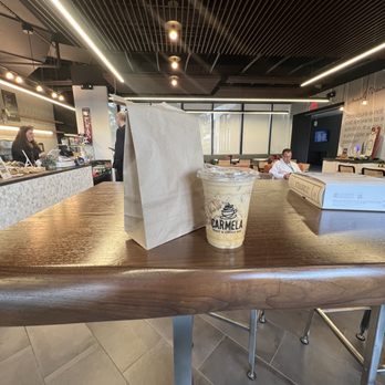 Carmela Coffee - BRiC - a cup of coffee on a table - Coffee & Tea Near Me - Boca Raton, Florida