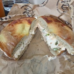 Asiago bagel with Sriracha bacon and chives cream cheese. Asiago bagel with Sriracha bacon and chives cream cheese.