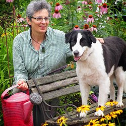 Garden-911 Boston - Garden-911 Boston owner Carol Lundeen and her pup, Harper, in their home garden in North Easton, MA.