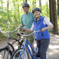 Riverwoods Manchester - Bill and Janet biking at Livingston park