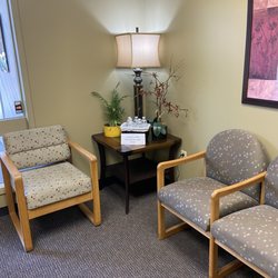 Hearing Specialty Center - Our waiting room, with chairs, plants, and complementary bottled water.
