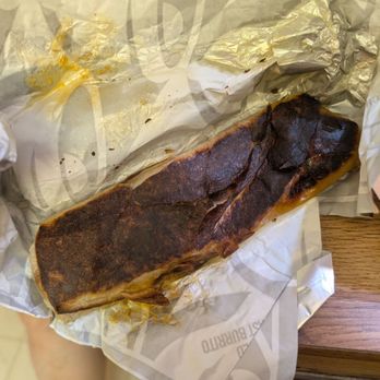 Taco Bell - This is how burnt the beefy potato burrito was on both sides and on two burritos! So disappointing. - 7/2026 - Tacos Near Me - Dublin, California