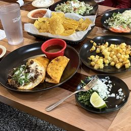 Birria tacos, chalupas, grilled pineapple, chips and salsa Birria tacos, chalupas, grilled pineapple, chips and salsa