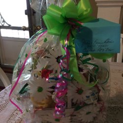 All Occasion Floral & Gift - The picture with the flower basket is what I ordered. The cellophane picture with the green bow is what I received.