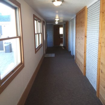 Edmonds' Au Gres Inn - Hallway to suite. Everything is clean. Inn has a wonderful clean scent. Hallways are done with wood and rock. Rooms have nice wood floors. - Hotels Near Me - Au Gres, Michigan