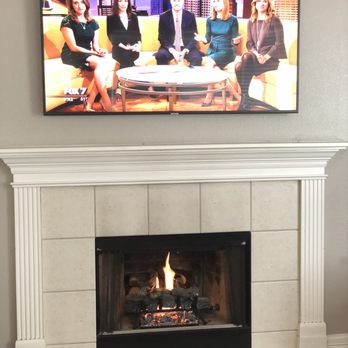 Austin TV Sales and Installation - Tv mounted above fireplace - Home Theatre Installation Near Me