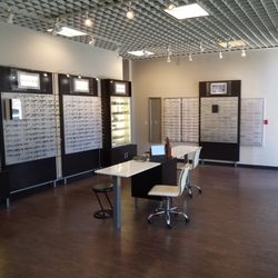 Bijan Cohenmehr, OD - Eyeglass frame display cabinets, with tables, chairs and mirrors to check out different frames.