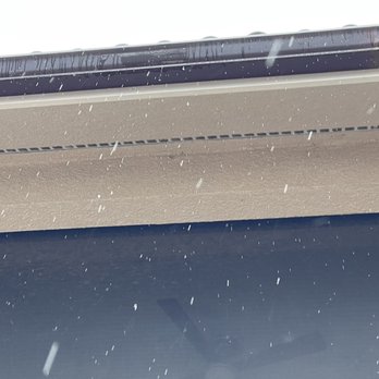 Structure Tech - It's not raining out.  This is coming from the bottom of the gutter, not overflowing. - Home Inspectors Near Me - Minneapolis, Minnesota
