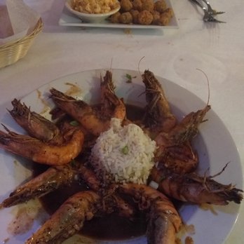 Fisherman's Corner - Head-on BBQ shrimp and pork chop in the background - Cajun/Creole Near Me - Pensacola, Florida
