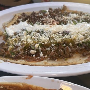 Taqueria El Timon - Huarache plate. Handmade the tortillas. It is a big plate, for two people. It has bean, meat, cheese, sour cream, etc. super good! 10/10 - Mexican Near Me - Montara, California Taqueria El Timon - Huarache plate. Handmade the tortillas. It is a big plate, for two people. It has bean, meat, cheese, sour cream, etc. super good! 10/10 - Mexican Near Me - Montara, California