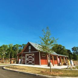 Barn with bathrooms; playground close behind it Barn with bathrooms; playground close behind it