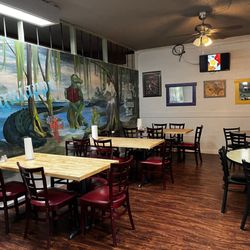 Friday's Seafood And More - Inside mural eating area