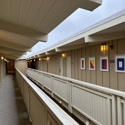 3-story motel-like structure with covered walkways