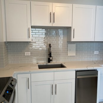 Remarkable Countertops - White quartz countertops with beautiful italian marble-esque veins with quartz undermount sink. - Countertop Installation Near Me - Chicago, Illinois