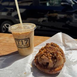 Iced latte and a sticky bun with walnuts Iced latte and a sticky bun with walnuts