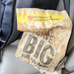 McDonald's - My rain-soaked food bag from waiting in the drive-thru pull-forward waiting line.