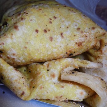 Grumpy Claude's - Roti Curry Stew wrap with chicken, close-up. - Food Trucks Near Me