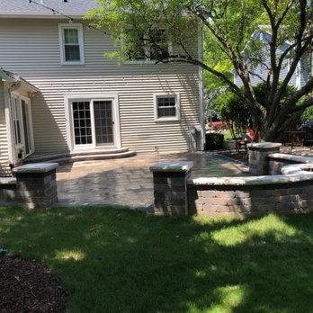 Sunny Landscaping & Pavers - Patio with fire pit on the wall and steps - Landscaping Near Me - Naperville, Illinois Sunny Landscaping & Pavers - Patio with fire pit on the wall and steps - Landscaping Near Me - Naperville, Illinois