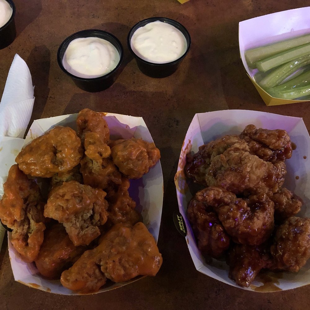 Boneless wings with spicy garlic sauce (left) and honey BBQ sauce (right) Boneless wings with spicy garlic sauce (left) and honey BBQ sauce (right)