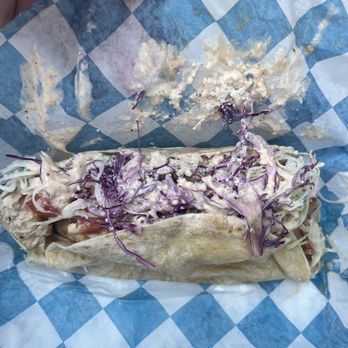 Lewis Seafood Shack - a hand holding a sandwich - Seafood Near Me - Topsail Beach, North Carolina