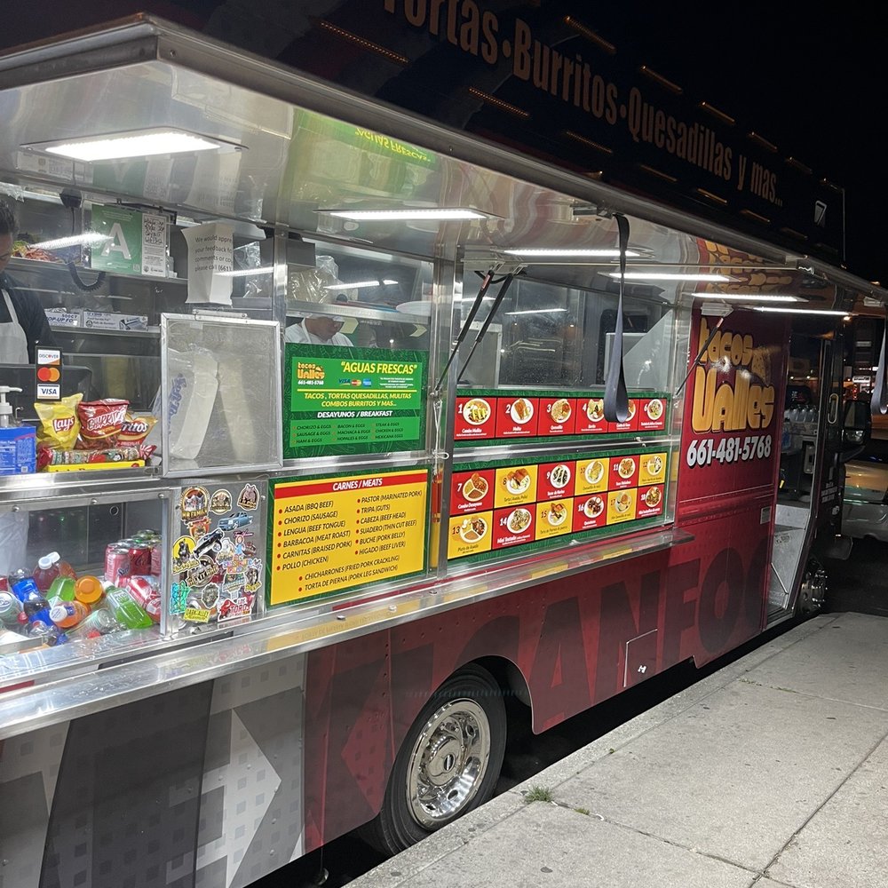 a food truck parked on the side of the road a food truck parked on the side of the road