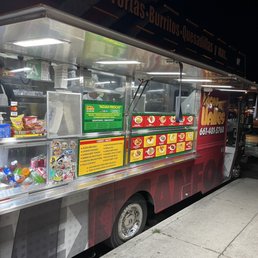 a food truck parked on the side of the road